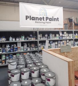 Paint display selling cheap and reusable paint at a Community RePaint Scheme.