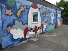 Community wall painted mural using cheap and affordable recycled paint from Community RePaint scheme.