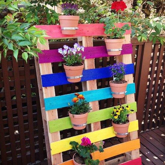 painted wooden pallet turned into a plant pot holder