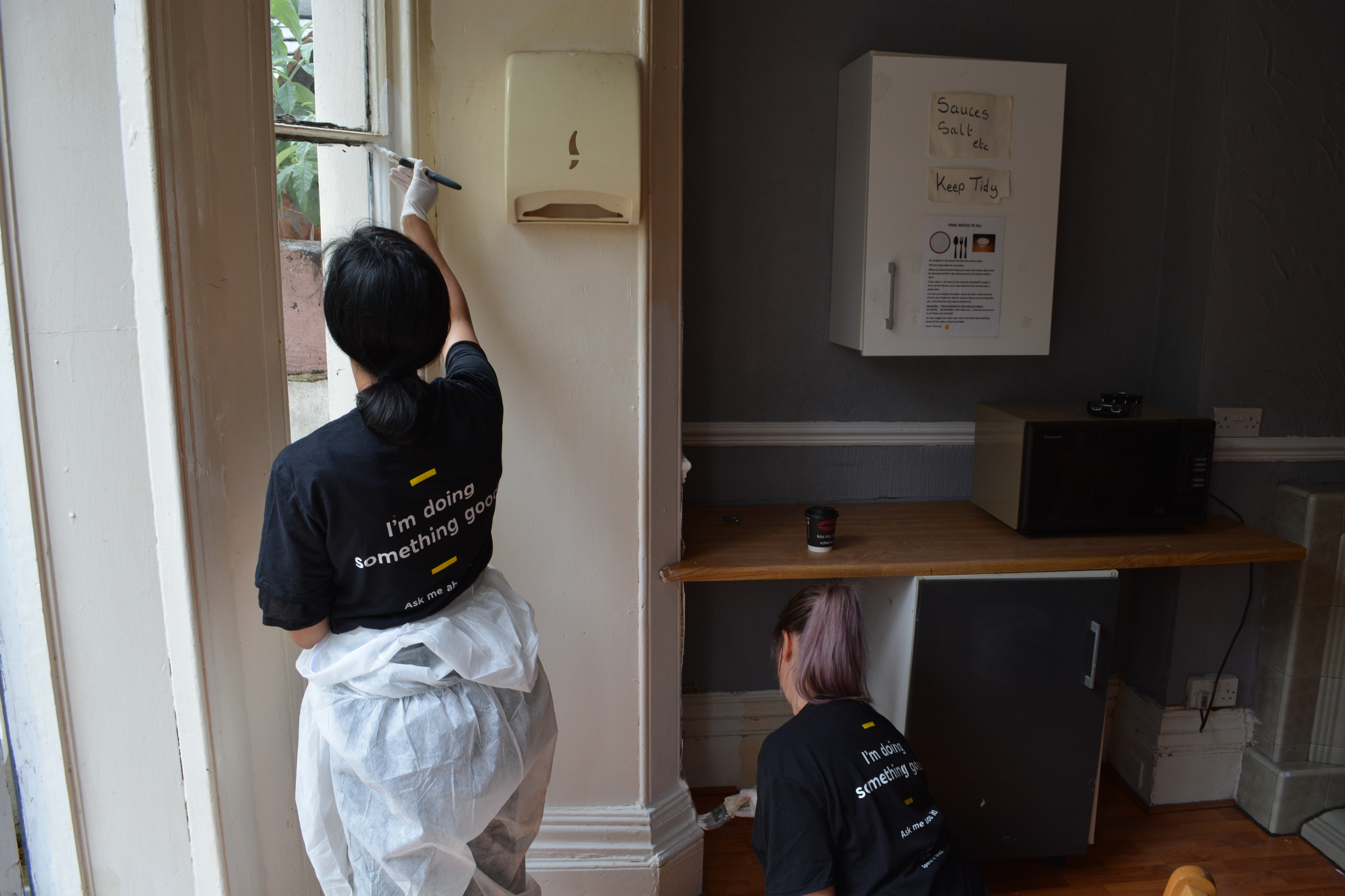Redecorating a kitchen at Community RePaint Sandwell and Soho.
