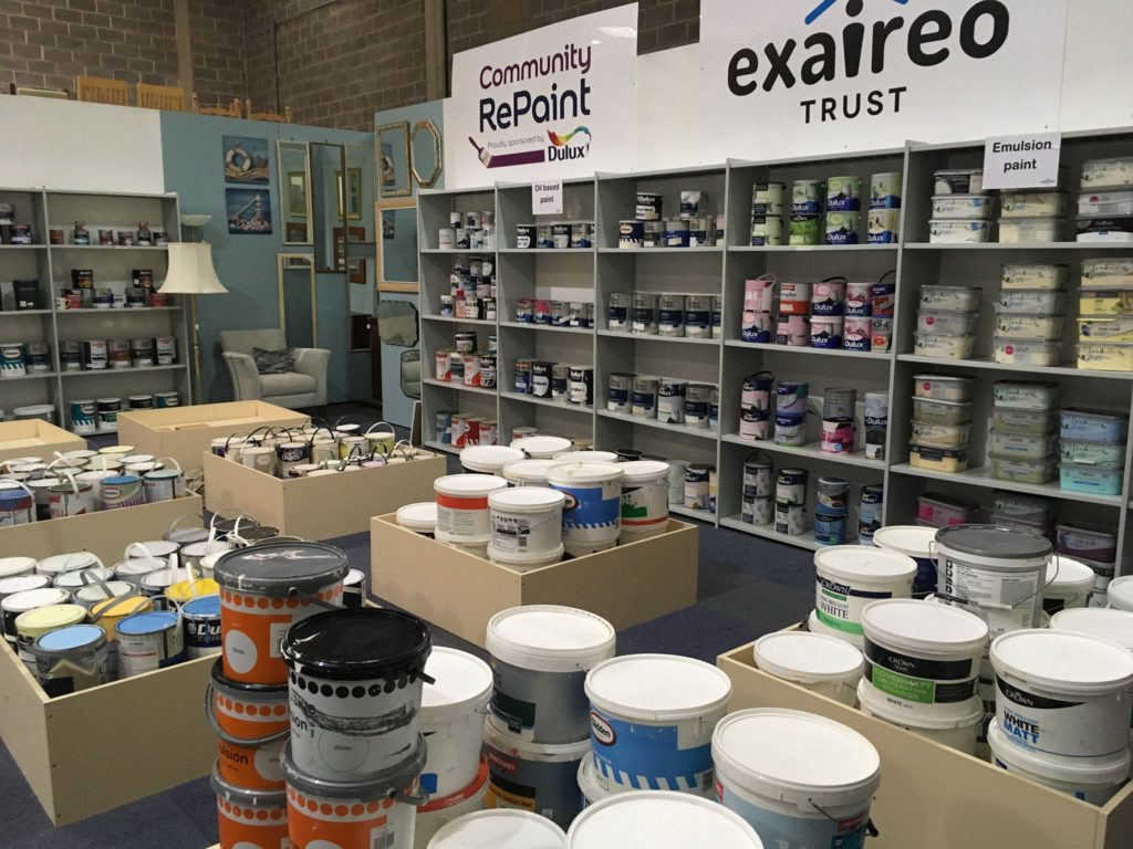 Paint display selling cheap and reusable paint at a Community RePaint Scheme.