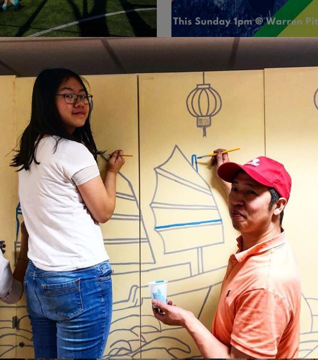 Members of the London Chinese Community Centre painting a mural using cheap and reusable paint from Regis Road Household Waste Recycling Centre.