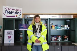 Jane Matthews Holding Tin at Community RePaint Shetland