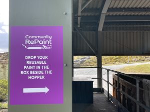 A photograph of Community RePaint signage at the Gremista Waste Management Facility.